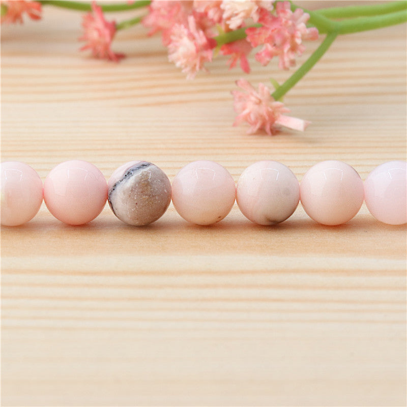 Бусины из натурального розового опала круглые 8мм отв. 1мм примерно 50шт длина 39см