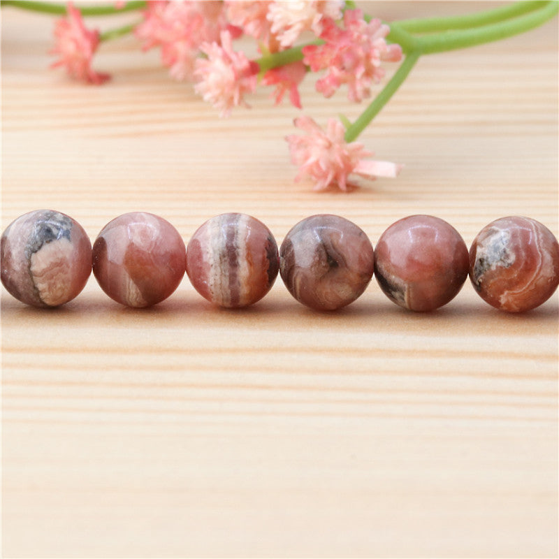 Perles Rhodochrosite naturelles rondes 8mm trou 1mm environ 50pcs sur fil 39cm