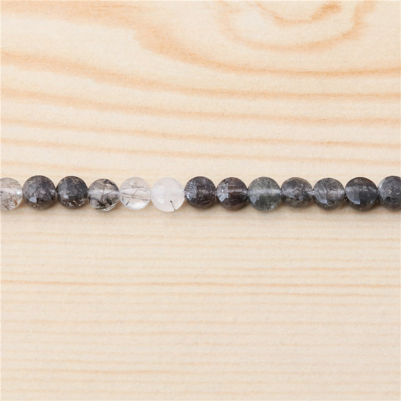 Perles rutilées de quartz noir naturel rondes et plates à facettes trou de 4mm 0.6mm environ 95pcs sur fil de 39cm